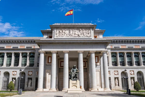 statue in front of the prado museum entrance